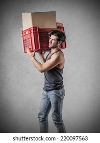 Man Carrying A Heavy Box 