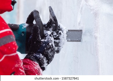 Man Carves Ice Sculpture Electric Saw Close-up