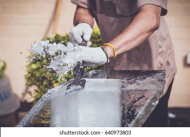 Man Is Carving The Ice Sculpture For Wedding