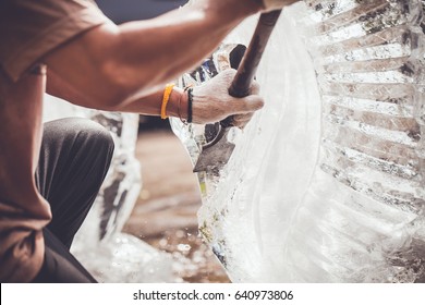 Man Is Carving The Ice Sculpture For Wedding