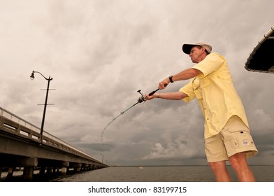 A man casting underneath