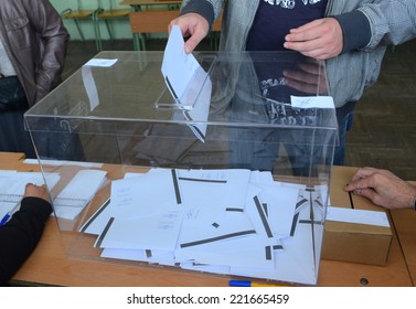 A Man Casts His Vote At A Polling Station In Sofia October 5, 2014. Bulgaria