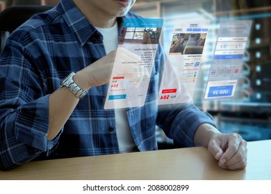 Man In Casual Cloth Interacting With Futuristic Virtual Screen Of Hotel Reservation And Travel Planning Application