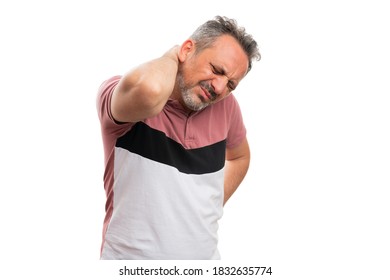 Man In Casual Summer Colourful Tshirt Touching Hurting Strained Back As Muscular Pain With Blank Copyspace For Advertising Text Isolated On White Background