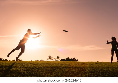 Man Catching A Frisbee. 