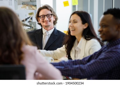 A man caucasian leadership smilling and african american In meetings about plans business at the meeting room in the office. Concept man manager leader