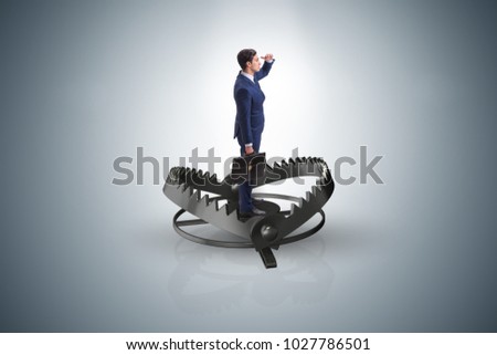 Man caught in mouse trap in risk business concept 