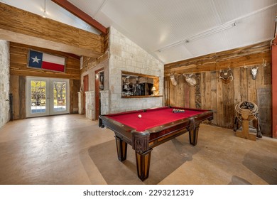 a man cave with a pool table 