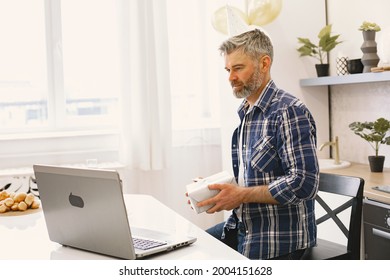 Man Is Celebrating His Birthday With Someone On The Skype Throught The Laptop