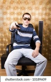man in a chair with remote control