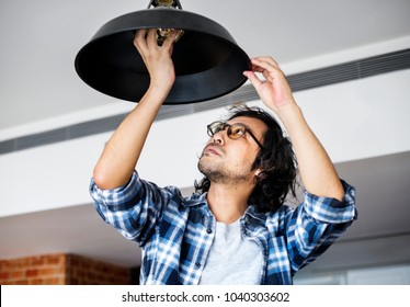 Man Changing Lightbulb