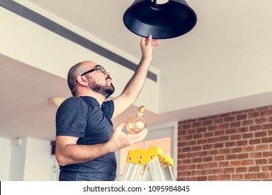 Man Changing Lightbulb