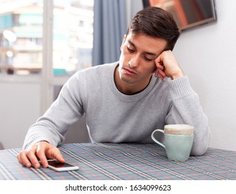 Man Is Chatting On Phone And Upset Alone At Home