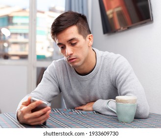 Man Is Chatting On Phone And Upset Alone At Home