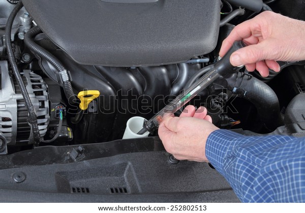 checking coolant level in car