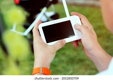 Man  Is Checking The  Baby Monitor For Security Of The Baby