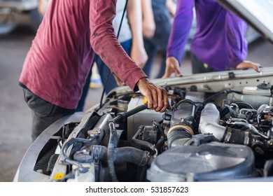 A Man Checking Car Engine