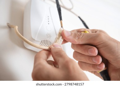  Man checking gas detector device.