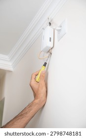  Man checking gas detector device.