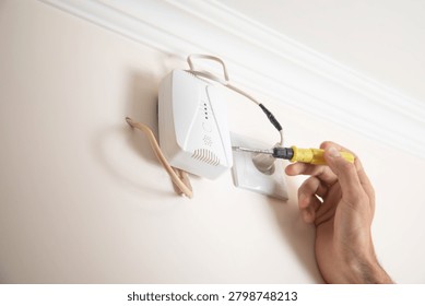  Man checking gas detector device.