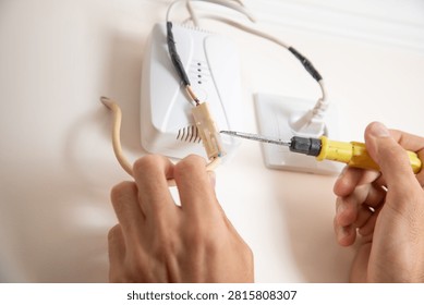  Man checking gas detector device.