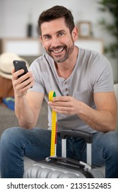 Man Checking Hand Luggage Measurements