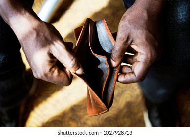 Man checking his empty wallet
