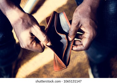 Man checking his empty wallet