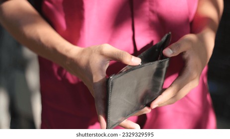 a man is checking his wallet