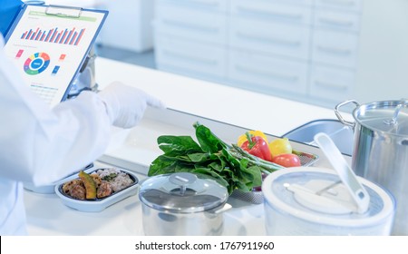 A man checking meals in the kitchen. Food management. - Powered by Shutterstock