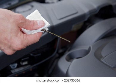 Man Checking Oil