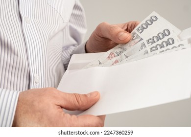 Man Checking Out Envelope With Cash. Czech republic koruna currency. Czechia finance concept. CZK large  nominal banknotes.