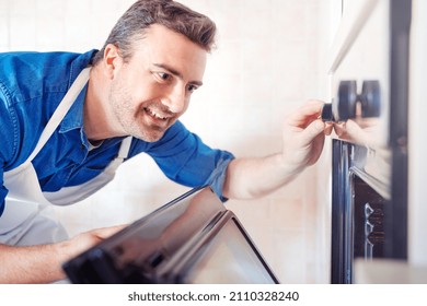 Man Checking Oven Temperature While Baking A Cake