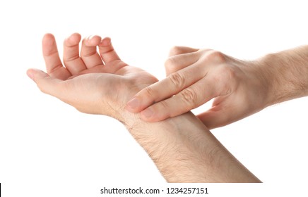 Man Checking Pulse On Wrist Against White Background, Closeup