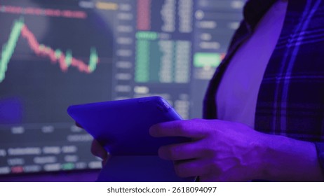 Man checking rate of cryptocurrency in application on laptop. Slow motion