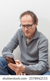 Man Checking Smartphone with Focus