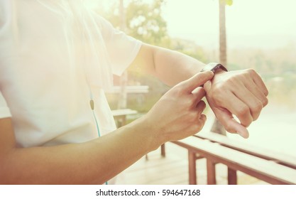 Man checking time after run