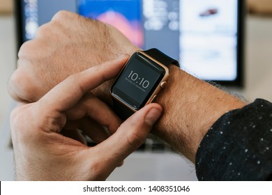 Man checking time on his smartwatch