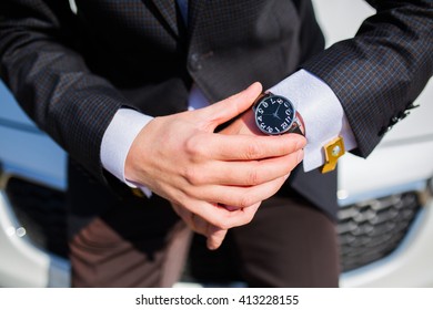 Man checking the time on his wrist watch