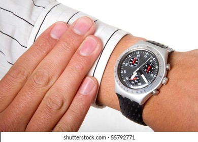 A man checking the time on his wrist watch