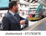 Man checking time in a train station
