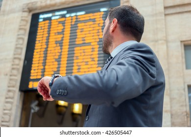 Man checking time in a train station