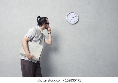 Man Checking Time In A Waiting Room 