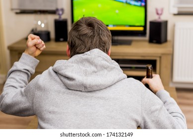 Man Cheering For Soccer Goal On Tv