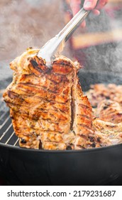 Man Chef Cooking Chicken Meat On Grill Outdoor