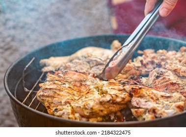 Man Chef Cooking Chicken Meat On Grill Outdoor