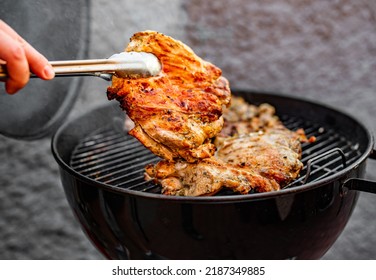 Man Chef Cooking Chicken Meat On Grill Outdoor