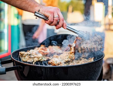 Man Chef Cooking Chicken Meat On Grill Outdoor