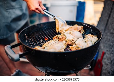 Man Chef Cooking Chicken Meat On Grill Outdoor