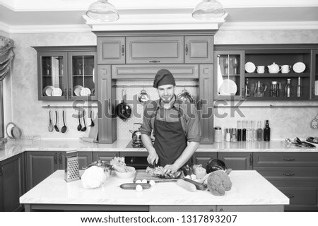 Similar – Image, Stock Photo Private bearded chef in apron standing at table while cutting avocado in kitchen